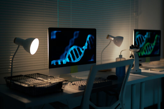 DNA research in laboratory with glowing screens