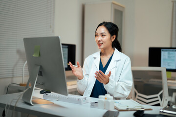 Asian doctor consulting online with patient telehealth
