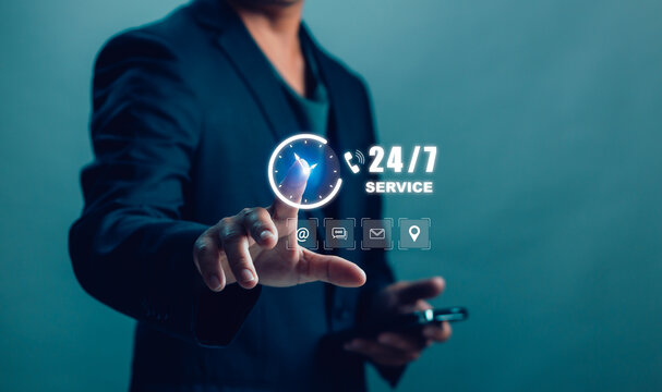 Businessman showing 24/7 contact us with icon , customer service concept, online support, and continuous communication for digital business