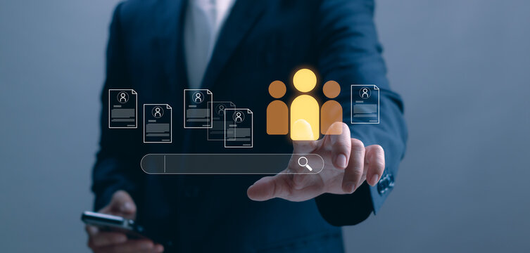 A business professional using a digital interface to search and evaluate candidate profiles, representing modern recruitment, HR technology, talent acquisition and data driven workforce selection