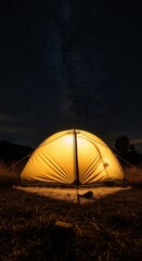 A glowing camping tent shines brightly under a breathtaking night sky filled with countless twinkling stars