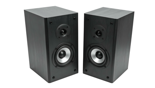 Pair of dark, modern rectangular loudspeakers, angled slightly, isolated on black background