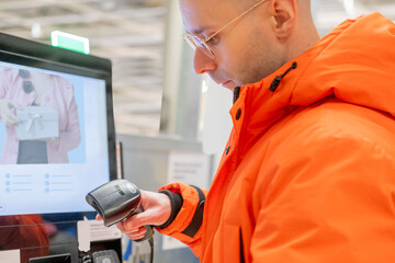 modern consumer scanning qr code on self-checkout screen in store warehouse, retail experience with touchless payment options, self service shopping, retail experience, easier customer transactions