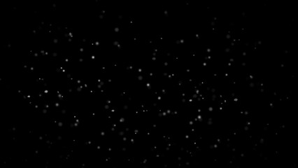Winter freeze motion of white snow coming down, isolated on black background. Snowfall texture overlay.