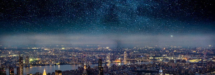 Aerial panoramic view of Manhattan under a starry night sky with city lights and skyline reflections
