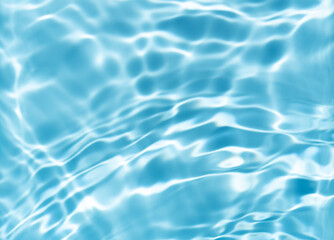 The surface of the water is clear and blue with ripples