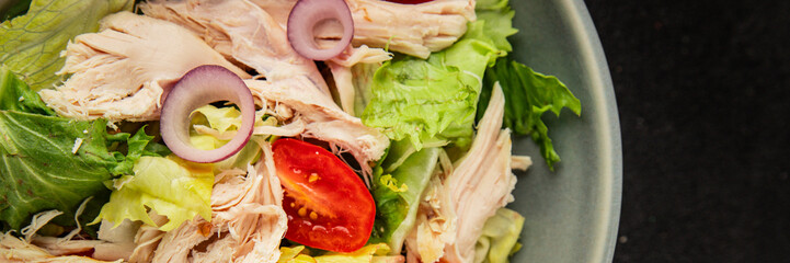 Salad chicken meat and vegetables tomato, green leaf lettuce, onion natural product tasty snack fresh delicious gourmet food background on the table rustic top view copy space keto and paleo diet