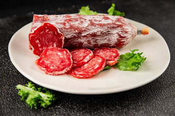 Dry sausage slice pork less fat jamon cured meat natural product tasty snack fresh delicious gourmet food background on the table rustic top view copy space