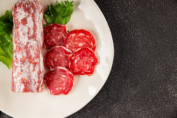 Dry sausage slice pork less fat jamon cured meat natural product tasty snack fresh delicious gourmet food background on the table rustic top view copy space