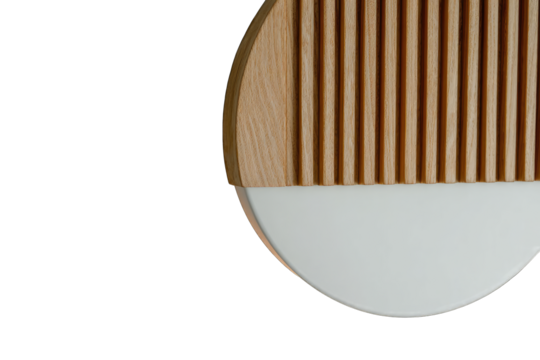 Close-up of a light fixture with a wooden slatted section and a white circle
