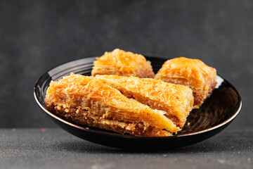 Baklava with pistachios and almonds dessert oriental sweets natural product tasty snack fresh delicious gourmet food background on the table rustic top view copy space