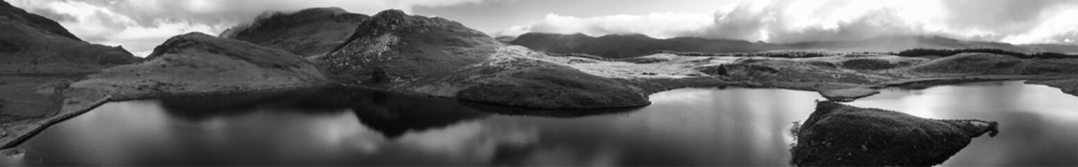 Aerial black and white panorama of Llyn y Dywarchen and the Snowdonia mountains