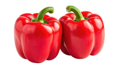 Two vibrant, perfectly formed red bell peppers with their green stems still attached are set against a transparent backdrop