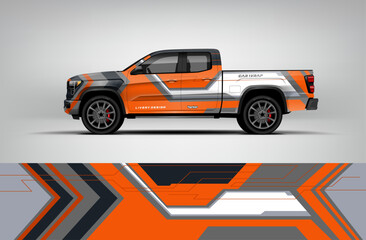 Orange, gray, and white pickup wrap with futuristic arrow-lined shapes creating a strong and sporty truck appearance. EPS vector included. © Wrapin