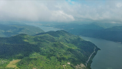 Aerial view on Danube river and mountains under clouds