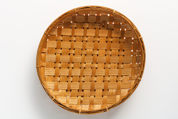 Top view of a Winnowing Basket (Tampah), isolated on a white background.