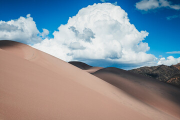 Sand dunes, sky and cloud in Colorado