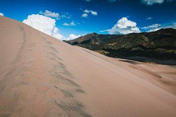 Dune ridge and green mountain in Colorado