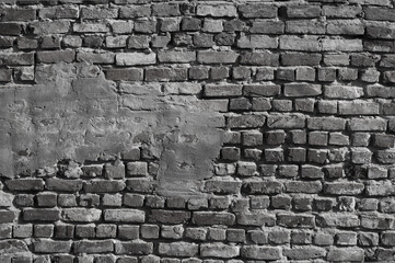 gray background, in the photo the texture of an old brick and plaster wall