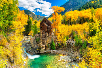 Abandoned mill near Crystal in Colorado surounded by golden colors