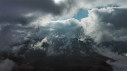 Aerial high view of dramatic clouds and sun