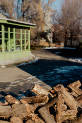 Rustic Winter Yard with Firewood and Wooden House