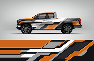 White and orange pickup wrap featuring layered geometric panels with technical racing-inspired shapes. Editable vector EPS included. © Wrapin