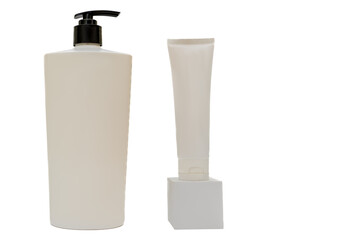 A white plastic container with a black dispenser cap on a white background. Cosmetic cream on a podium.