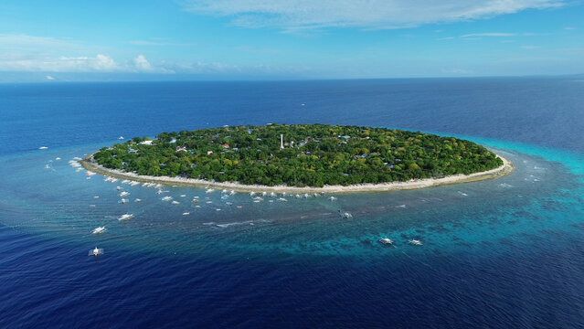Tropical island with turquoise water and coral reef