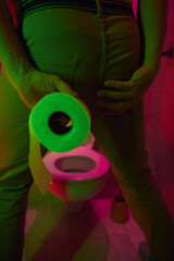 Man with urge to go to the toilet at home.