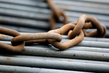 Heavy Steel Rods Secured with Chain for Construction Transport Safety