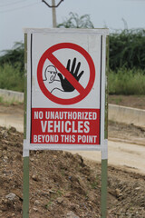 Unauthorized Vehicles Prohibited Sign on Rural Dirt Road
