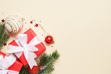 Christmas present, balls and fir tree branches.