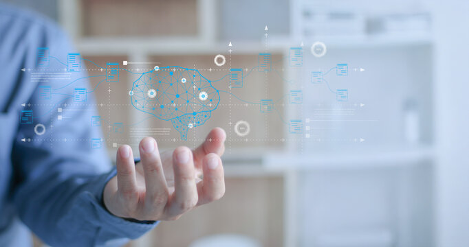 The digital brain and the flow of information outside the hands of business people are AI analytics, machine learning processes, intelligent automation, and advanced data integration in technology. - Powered by Adobe