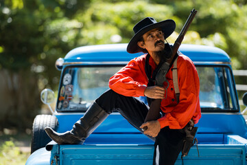 A cowboy laughing together around a vintage pickup truck, surrounded by smoke and sunlight © Wosunan