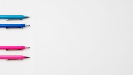 Four colored pens arranged horizontally on a white background.