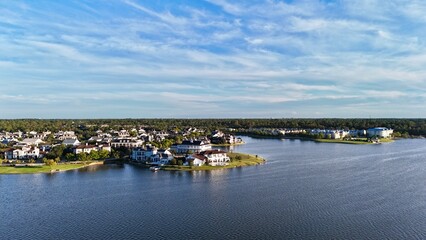 Aerial view of large mansion houses with swimming pool,  in affluent neighborhood  by Woodlands lake, Houston, Texas, expensive suburban homes surrounding by lush green trees, USA
