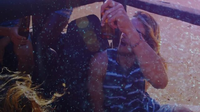 Friends sharing beer in truck, overhead pass starting bonding, snack, lens flare boosting lifestyle
