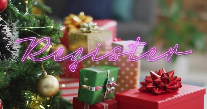 Soft cursive script appearing tracing into pink neon Register over gifts near tree inviting signup