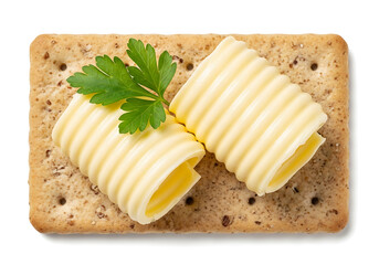 Rolled butter curls on a cracker with parsley garnish