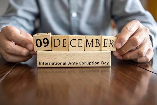 International Anti-Corruption Day image with wooden blocks spelling December 9 on labeled base generative ai - Powered by Adobe