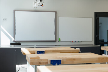 Modern classroom setting with bright light and neatly arranged workstations