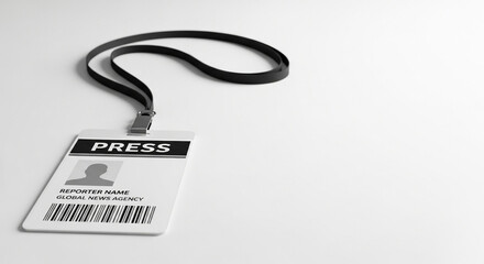 Press ID badge on a lanyard with black strap on white background  