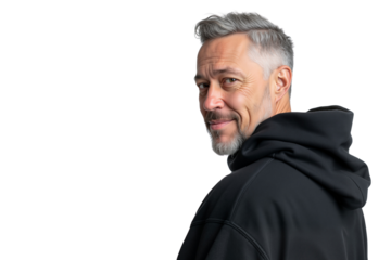 Mature man with grey hair smiling over his shoulder and wearing a black hoodie, isolated on transparent background