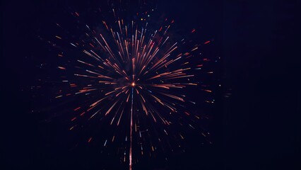 Fireworks display captured at night with vibrant explosions. Celebration and festivity, colorful fireworks, night sky, event. The concept of celebration and fireworks display.