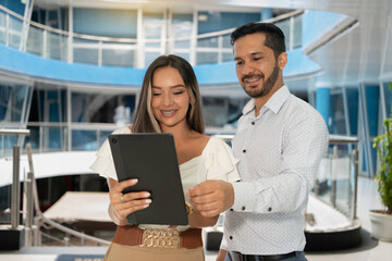 Happy businessman and businesswoman celebrating success. Successful entrepreneurs achieving goals