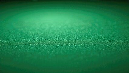 Aesthetic green background with a gradient and fine sparkling particles. Concept of elegance, freshness, and tranquility. Abstract design with soothing visual appeal.