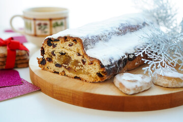 German Christmas stollen cake with dried fruit and nuts kneaded in, dusted with powdered sugar