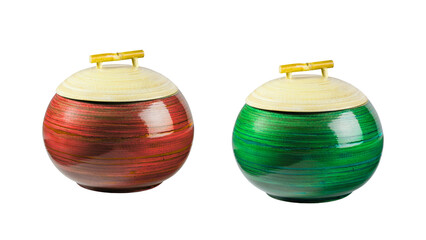 A pair of handcrafted red and green round bamboo canisters with lids, ideal for decorative kitchen or home storage, isolated on a transparent background