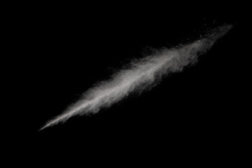 White powder explosion on black background. Colored cloud. Colorful dust explode. Paint Holi.